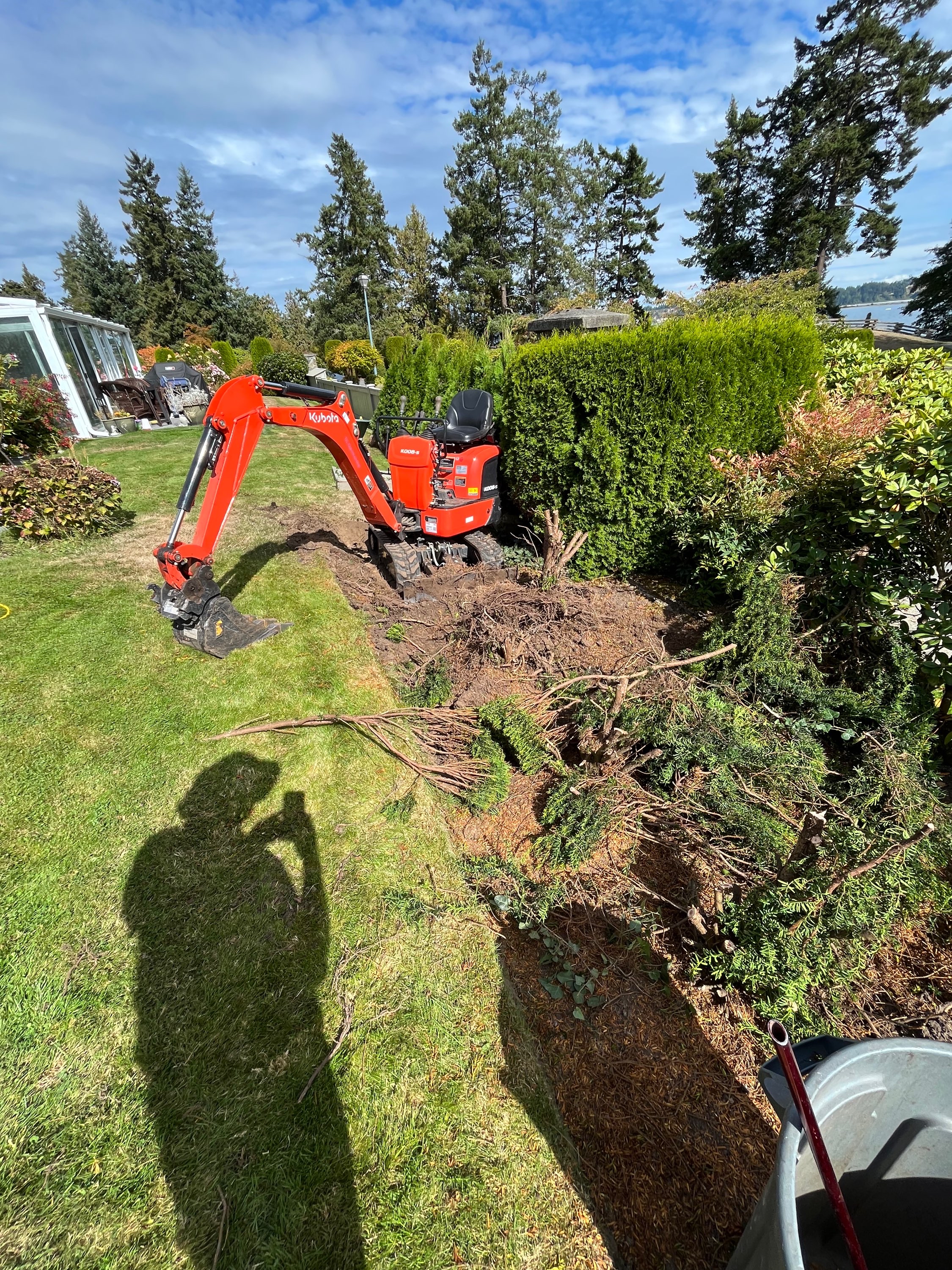 TC Contracting equipment working in a tight backyard space